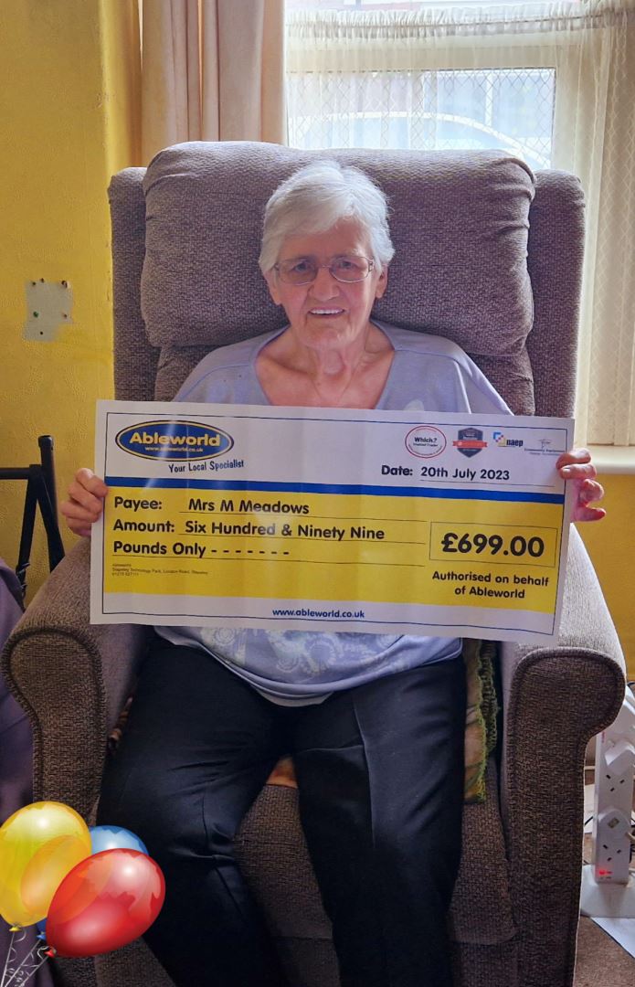 Ableworld Gloucester win back the cost of your adjustable bed winner holding cheque for the total cost of her purchase